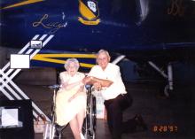 Lucy Goff and Don Weckhorst in front of plane named Lucy