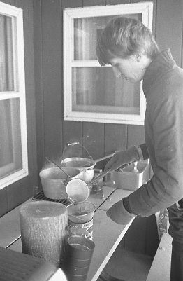 Unidentified man making maple syrup