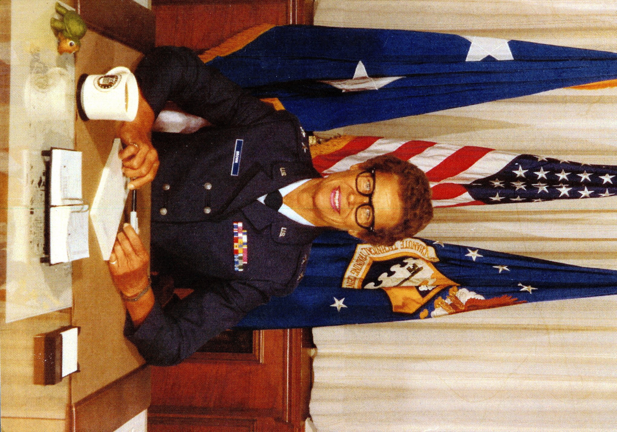 Portrait of Commanding Officer Norma E. Brown at her desk.