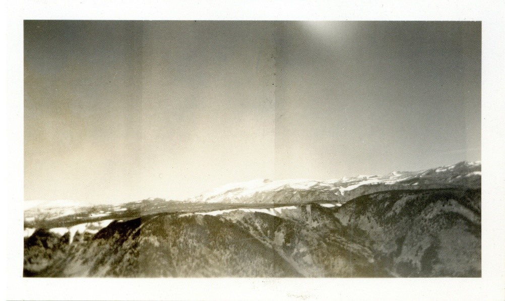 Black and white photograph of a mountain range.