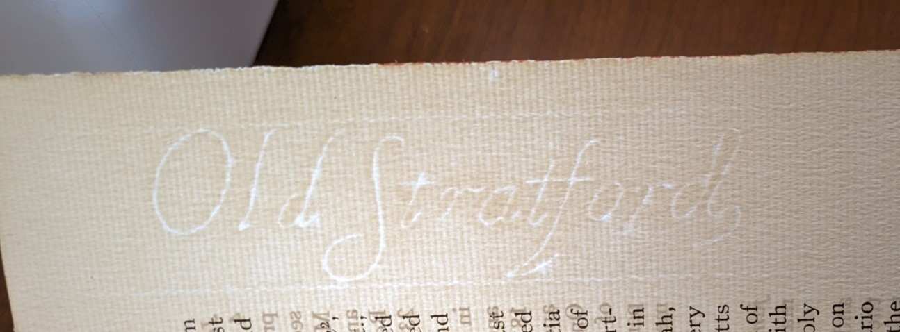 Image of a watermark on a page in a book. The watermark reads, "Old Stratford."