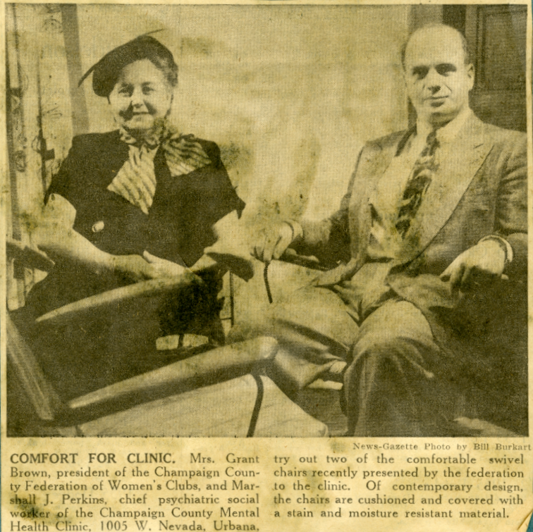 Newspaper clipping and image of a seated man and woman. The caption (below) reads, "Comfort for clinic. Mrs. Grant Brown, president of the Champaign County Federation of Women's Clubs, and Marshall J. Perkins, chief psychiatric social worker of the Champaign County Mental Health Clinic, 1005 W. Nevada, Urbana, try out two of the comfortable swivel chairs recently presented by the federation to the clinic. Of contemporary design, teh chairs are cushioned and covered with a stain and moisture resistant material."