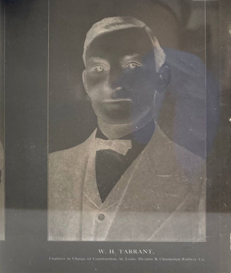 A photograph of a glass plate negative of a man from the chest up.