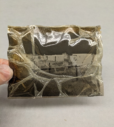 A color photograph of a negative identified as experiencing degradation due to vinegar syndrome at level 6. 
