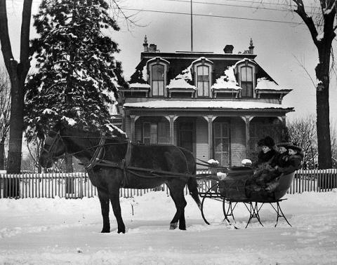Horse-drawn sleigh outside of the William Redhed House, Tolono (IL), ca. 1890