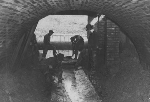 WPA relief workers laying a concrete floor in the Boneyard branch outlet.