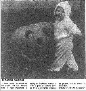 Toddler with 80 pound pumpkin, October 1977