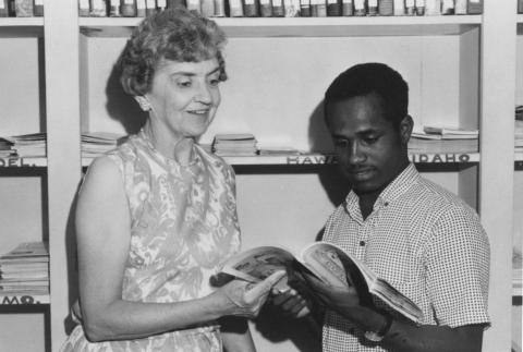 Lucy Goff and an airman read together