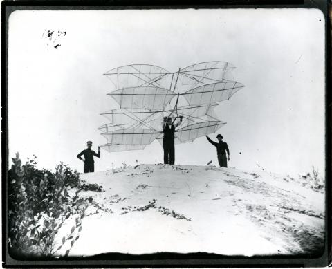 Octave Chanute and two others test his prototype glider 
