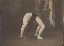 Walter C. Glines, ca. 1910, posing in a backbend position