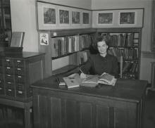 Bernice Fiske sitting at desk, 1949