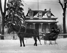 Horse-drawn sleigh outside of the William Redhed House, Tolono, ca. 1890.
