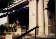 Sign on exterior of library announcing closure due to recent fire