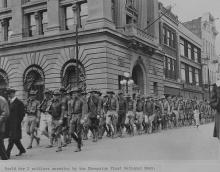 World War I soldiers marching by Champaign First National Bank.