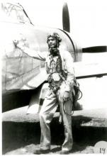 George Roberts posing by plane 